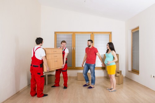 Organised storage unit space with boxes and furniture