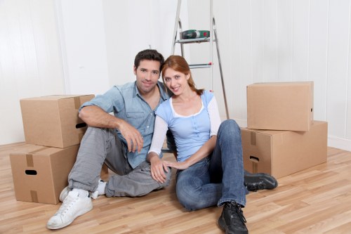 Local moving team loading boxes and furniture into a van