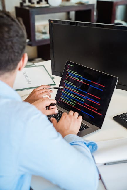The image shows a computer screen displaying a code editor with HTML and CSS code visible on the dark interface. The code includes tags such as <html>, <head>, <title>, and links to stylesheets, indic